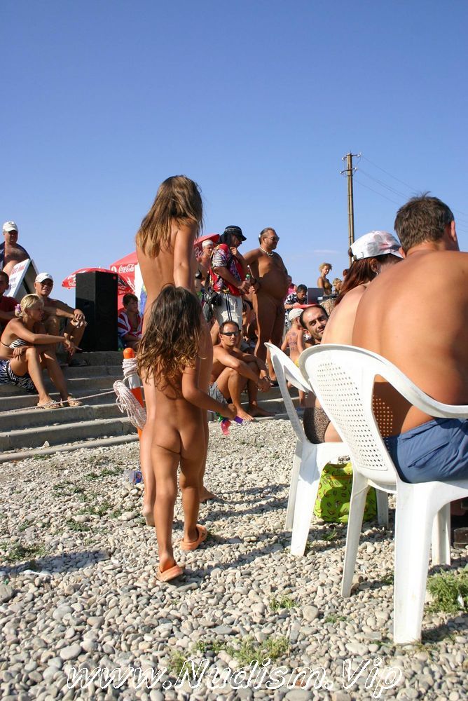 [Image: Naturist-Standing-Sideline-Pure-Nudism-Photos-2.jpg]
